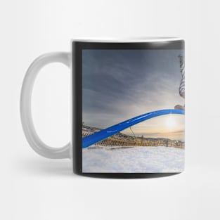 Snowboarder sliding on a rail Mug